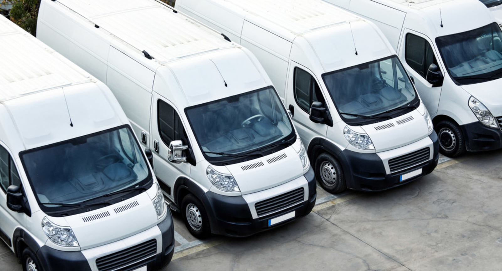 A commercial vehicle insurance policy document being reviewed by a business owner, highlighting the comprehensive coverage offered by Insurance Company Grove City to protect trucks and fleets from financial risk.