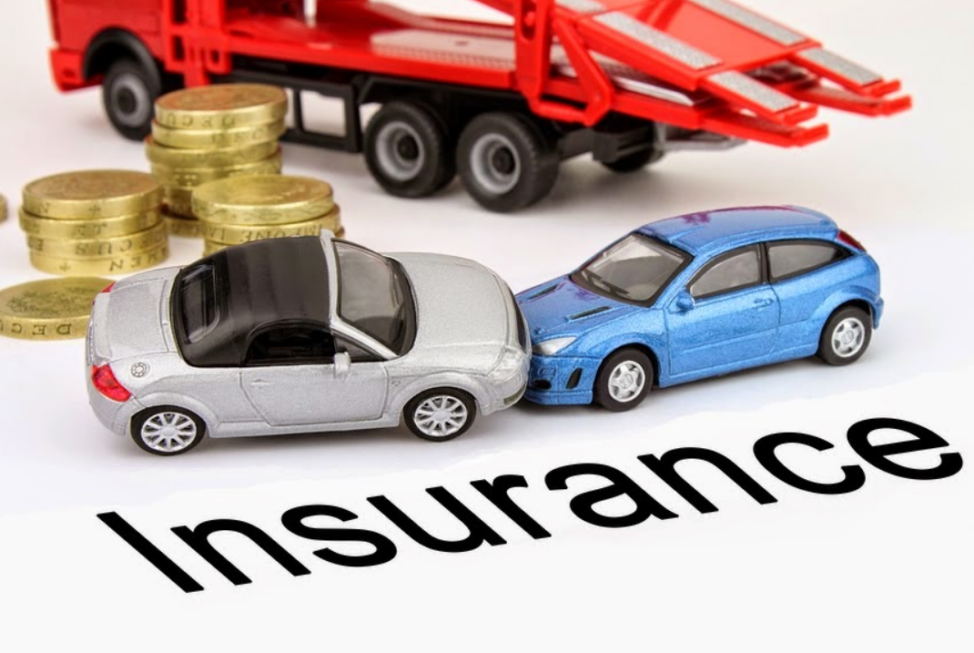 Red sedan on a city street, representing auto insurance options in Grove City.