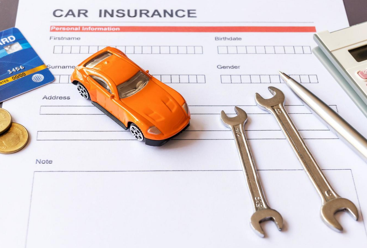 An Insurance Company Grove City customer service representative discusses auto insurance options with a client.