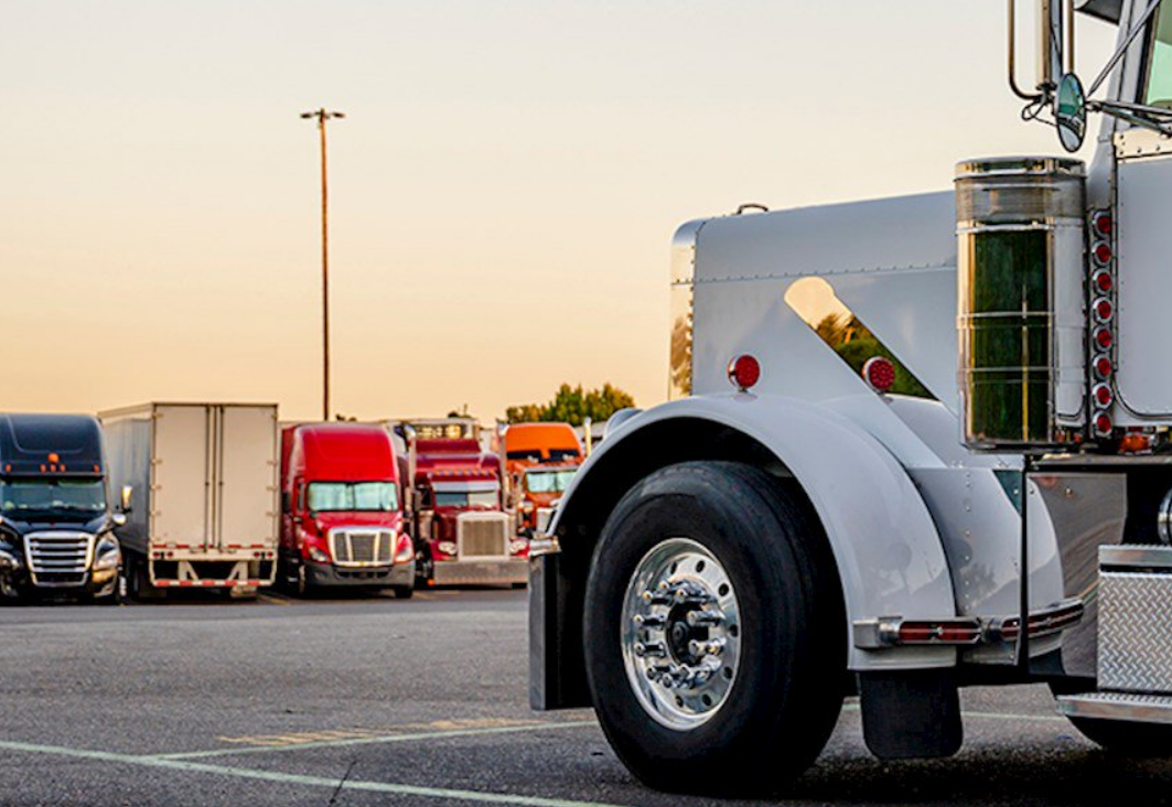 Truck driving on a highway showcasing reliable trucking insurance coverage by Insurance Company Grove City
